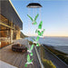 Solar-Powered Dangling Hummingbird Lights - PlanetShopper